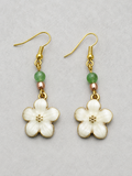 Daisy drop enamel earrings with gold tone spacers and green glass beads