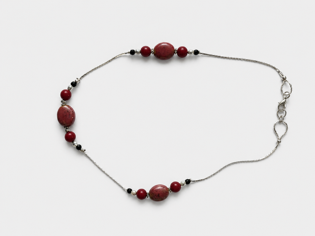 Necklace with draw bench ceramic beads in each station reds and mottled
