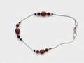 Necklace with draw bench ceramic beads in each station reds and mottled