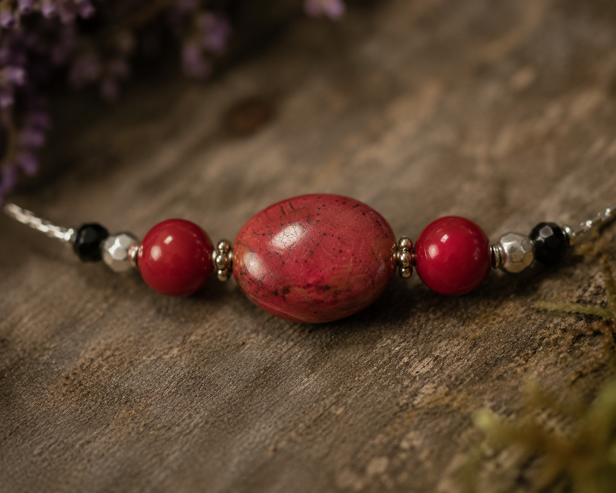 Necklace with draw bench ceramic beads in each station reds and mottled