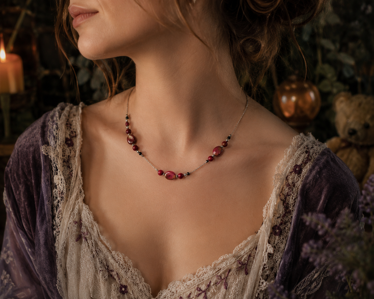 Necklace with draw bench ceramic beads in each station reds and mottled